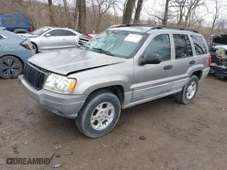 1999 Jeep Grand Cherokee Laredo with VIN 1J4GW58N0XC748809, listed as a IAAI auction lot 41722910 with 201,407 mi miles. Bid and sale history available at carsss.com. Image 17.