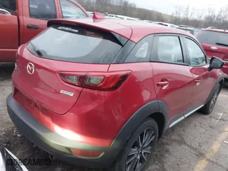 2018 Mazda CX-3 Grand Touring with VIN JM1DKFD75J0305565, listed as a IAAI auction lot 41135957 with 26,810 mi miles. Bid and sale history available at carsss.com. Image 4.