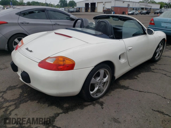 2001 Porsche Boxster z VIN WP0CA29821U622592, wystawiony jako Copart lot #56050735 z przebiegiem Nie podano mil oraz Szkoda całkowita • Salvage title. Historia ofert i sprzedaży dostępna na DreamBid. Obrazek 3.