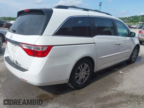 2011 Honda Odyssey EX-L with VIN 5FNRL5H60BB026171, listed as a IAAI auction lot 42511296 with 288,827 mi miles and . Bid and sale history available at DreamBid. Image 4.