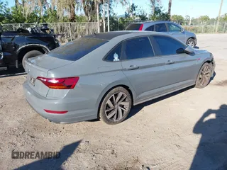 2019 Volkswagen Jetta GLI S z VIN 3VW6T7BU5KM169132, wystawiony jako IAAI lot #41599605 z przebiegiem 59 744 mil mil oraz . Historia ofert i sprzedaży dostępna na DreamBid. Obrazek 4.