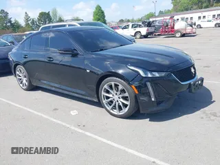 2021 Cadillac CT5 Sport z VIN 1G6DP5RK7M0147794, wystawiony jako IAAI lot #41951168 z przebiegiem 72 846 mil mil oraz . Historia ofert i sprzedaży dostępna na DreamBid. Obrazek 1.