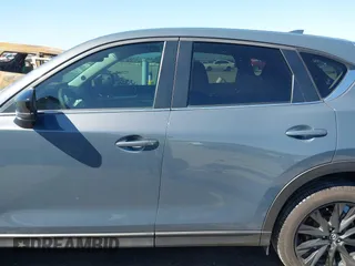 2021 Mazda CX-5 Touring with VIN JM3KFACM1M0317763, listed as a IAAI auction lot 41775712 with 75,068 mi miles. Bid and sale history available at carsss.com. Image 14.