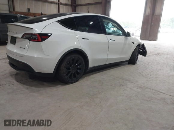2020 Tesla Model Y Long Range z VIN 5YJYGDEE5LF041935, wystawiony jako IAAI lot #42369750 z przebiegiem 79 540 mil mil oraz . Historia ofert i sprzedaży dostępna na DreamBid. Obrazek 4.