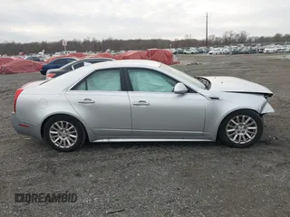 2012 Cadillac CTS z VIN 1G6DA5E50C0152626, wystawiony jako IAAI lot #41101077 z przebiegiem 104 324 mil mil oraz . Historia ofert i sprzedaży dostępna na DreamBid. Obrazek 13.
