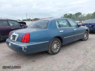 2002 Lincoln Town Car Sig. with VIN 1LNHM82W12Y665626, listed as a IAAI auction lot 42041230 with 1 mi miles. Bid and sale history available at carsss.com. Image 4.