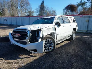 2019 GMC Yukon XL SLT with VIN 1GKS1GKC1KR335082, listed as a IAAI auction lot 41652504 with 135,824 mi miles. Bid and sale history available at carsss.com. Image 2.