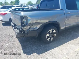 2020 Honda Ridgeline RTL with VIN 5FPYK3F5XLB019296, listed as a IAAI auction lot 42204290 with 48,197 mi miles and . Bid and sale history available at DreamBid. Image 6.