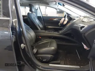 2013 Lincoln MKZ z VIN 3LN6L2G94DR823887, wystawiony jako IAAI lot #42054666 z przebiegiem 101 866 mil mil oraz . Historia ofert i sprzedaży dostępna na DreamBid. Obrazek 5.