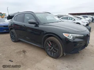 2019 Alfa Romeo Stelvio Ti with VIN ZASPAKBNXK7C44188, listed as a IAAI auction lot 41320657 with 89,927 mi miles. Bid and sale history available at carsss.com. Image 1.