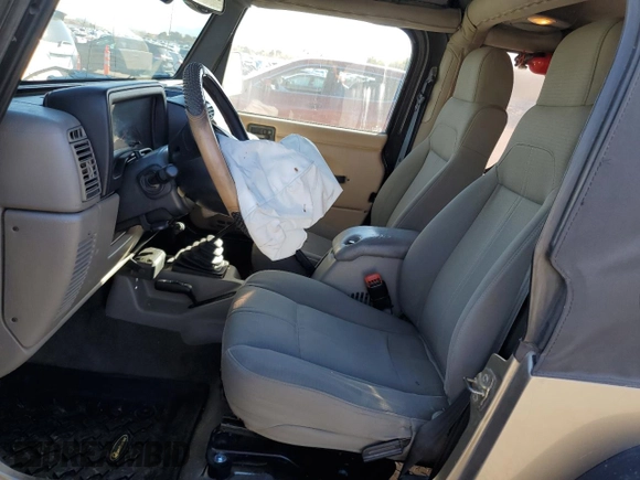 2003 Jeep Wrangler Sahara z VIN 1J4FA59S43P369233, wystawiony jako Copart lot #46517565 z przebiegiem 169 232 mil mil oraz Szkoda całkowita • Salvage title. Historia ofert i sprzedaży dostępna na DreamBid. Obrazek 7.