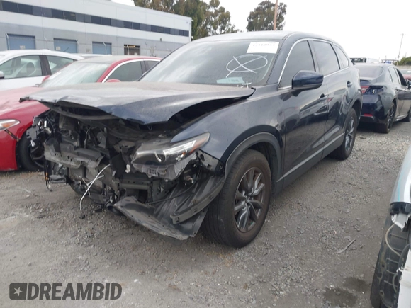 2021 Mazda CX-9 Touring with VIN JM3TCACY9M0526880, listed as a IAAI auction lot 42310923 with 25,991 mi miles and . Bid and sale history available at DreamBid. Image 20.
