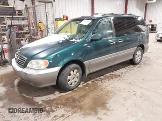 2003 Kia Sedona LX with VIN KNDUP131336390410, listed as a IAAI auction lot 41602426 with 170,613 mi miles. Bid and sale history available at carsss.com. Image 2.