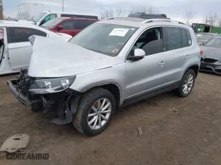 2017 Volkswagen Tiguan Wolfsburg Edition with VIN WVGSV7AX8HK031345, listed as a IAAI auction lot 41348567 with 130,313 mi miles. Bid and sale history available at carsss.com. Image 2.