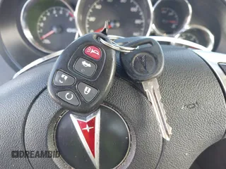 2009 Pontiac G6 1SA z VIN 1G2ZG57B394187803, wystawiony jako IAAI lot #41100404 z przebiegiem 242 388 mil mil oraz . Historia ofert i sprzedaży dostępna na DreamBid. Obrazek 11.