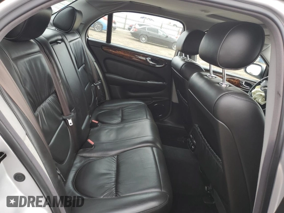 2004 Jaguar XJ with VIN SAJEA74C34SG09548, listed as a Copart auction lot 71754774 with 142,804 mi miles and Salvage Title. Bid and sale history available at DreamBid. Image 10.