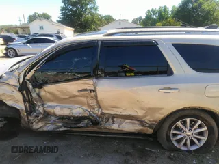 2014 Dodge Durango SXT with VIN 1C4RDHAG4EC266777, listed as a IAAI auction lot 42490301 with 210,544 mi miles and . Bid and sale history available at DreamBid. Image 14.