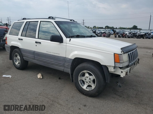 1997 Jeep Grand Cherokee Laredo with VIN 1J4GZ58S2VC676652, listed as a Copart auction lot 64939974 with 256,923 mi miles and Salvage Title. Bid and sale history available at carsss.com. Image 4.