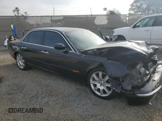 2004 Jaguar XJ with VIN SAJEA71C54SG01455, listed as a Copart auction lot 86591014 with 83,977 mi miles and Salvage Title. Bid and sale history available at carsss.com. Image 4.