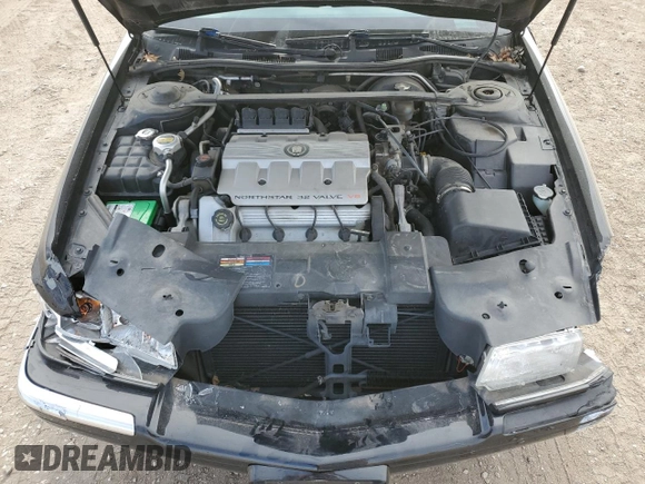 1999 Cadillac Eldorado Touring z VIN 1G6ET1298XU602343, wystawiony jako Copart lot #44327195 z przebiegiem 52 327 mil mil oraz Szkody całkowita. Historia ofert i sprzedaży dostępna na DreamBid. Obrazek 11.