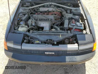 1989 Toyota Celica z VIN JT2ST67C8K7337876, wystawiony jako Copart lot #57918785 z przebiegiem 16 862 mil mil oraz Tytuł czysty. Historia ofert i sprzedaży dostępna na DreamBid. Obrazek 11.