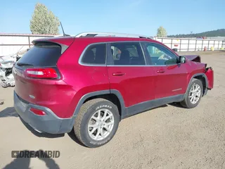 2016 Jeep Cherokee Latitude with VIN 1C4PJMCS8GW250318, listed as a IAAI auction lot 42126241 with 105,028 mi miles. Bid and sale history available at carsss.com. Image 4.