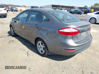 2014 Ford Fiesta SE z VIN 3FADP4BJ6EM117845, wystawiony jako IAAI lot #42431152 z przebiegiem 97 742 mil mil oraz . Historia ofert i sprzedaży dostępna na DreamBid. Obrazek 3.