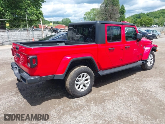 2023 Jeep Gladiator Sport S with VIN 1C6HJTAG8PL572270, listed as a IAAI auction lot 42336294 with 13,865 mi miles and . Bid and sale history available at DreamBid. Image 4.