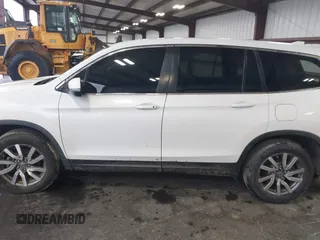 2021 Honda Pilot EX-L with VIN 5FNYF5H57MB022843, listed as a IAAI auction lot 41186957 with 57,836 mi miles. Bid and sale history available at carsss.com. Image 14.