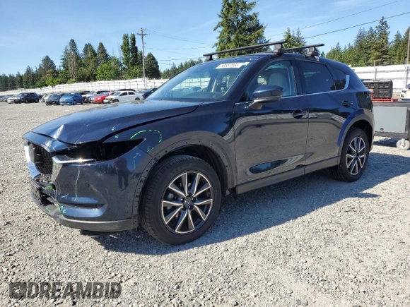 2018 Mazda CX-5 Grand Touring z VIN JM3KFBDM5J0379246, wystawiony jako Copart lot #58587865 z przebiegiem 46 339 mil mil oraz Szkody całkowita. Historia ofert i sprzedaży dostępna na DreamBid. Obrazek 1.