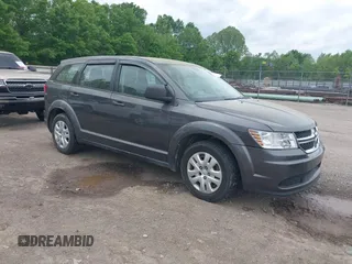 2015 Dodge Journey American Value z VIN 3C4PDCAB0FT573321, wystawiony jako IAAI lot #42158867 z przebiegiem 151 324 mil mil oraz . Historia ofert i sprzedaży dostępna na DreamBid. Obrazek 1.