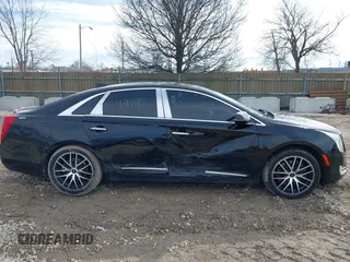 2015 Cadillac XTS Luxury z VIN 2G61N5S35F9155543, wystawiony jako IAAI lot #41699914 z przebiegiem 120 700 mil mil oraz . Historia ofert i sprzedaży dostępna na DreamBid. Obrazek 14.