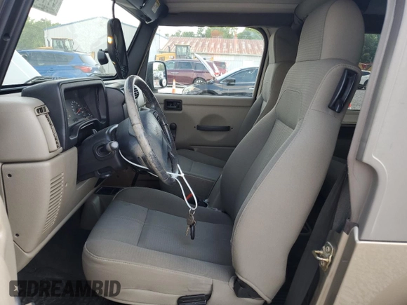 2003 Jeep Wrangler Sahara with VIN 1J4FA59S53P369077, listed as a Copart auction lot 61445025 with 147,904 mi miles and Clean title. Bid and sale history available at DreamBid. Image 7.