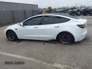 2023 Tesla Model 3 with VIN 5YJ3E1EA5PF505856, listed as a IAAI auction lot 41885837 with 28,206 mi miles and . Bid and sale history available at carsss.com. Image 13.