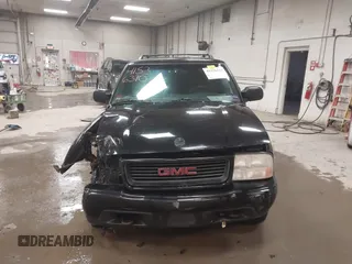 1999 GMC Jimmy SLS Comfort/Convenience with VIN 1GKCT18W1XK503719, listed as a IAAI auction lot 41536310 with 151,211 mi miles. Bid and sale history available at carsss.com. Image 12.