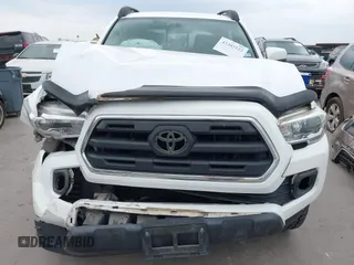2016 Toyota Tacoma SR5 z VIN 5TFAZ5CN5GX018977, wystawiony jako IAAI lot #42303122 z przebiegiem 99 545 mil mil oraz . Historia ofert i sprzedaży dostępna na DreamBid. Obrazek 12.