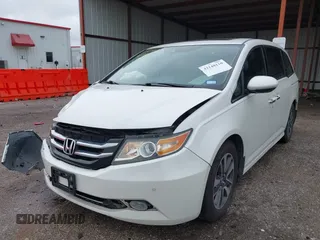 2014 Honda Odyssey Touring with VIN 5FNRL5H95EB059729, listed as a IAAI auction lot 42148110 with 135,304 mi miles and . Bid and sale history available at DreamBid. Image 18.