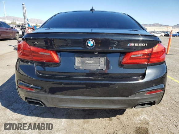 2018 BMW 5 Series M550i xDrive with VIN WBAJB9C55JG463848, listed as a Copart auction lot 48485765 with 47,078 mi miles and Salvage Title. Bid and sale history available at carsss.com. Image 6.