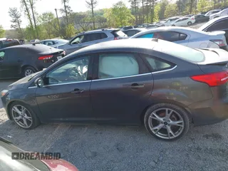 2016 Ford Focus Titanium with VIN 1FADP3J25GL282293, listed as a IAAI auction lot 41998959 with 119,781 mi miles and . Bid and sale history available at DreamBid. Image 14.