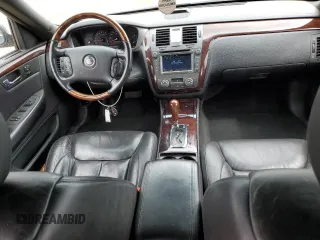 2007 Cadillac DTS Performance with VIN 1G6KD57937U201301, listed as a Copart auction lot 52868565 with 119,972 mi miles and Salvage Title. Bid and sale history available at carsss.com. Image 8.