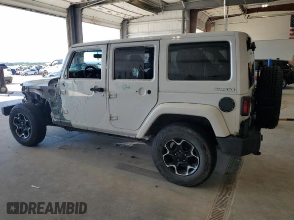2015 Jeep Wrangler Unlimited Sahara with VIN 1C4BJWEG2FL620001, listed as a Copart auction lot 63914725 with 114,810 mi miles and Salvage title. Bid and sale history available at DreamBid. Image 2.