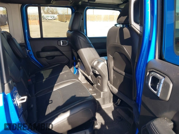 2023 Jeep Wrangler Sahara z VIN 1C4JJXP60PW513969, wystawiony jako IAAI lot #41766631 z przebiegiem 34 819 mil mil oraz . Historia ofert i sprzedaży dostępna na DreamBid. Obrazek 8.