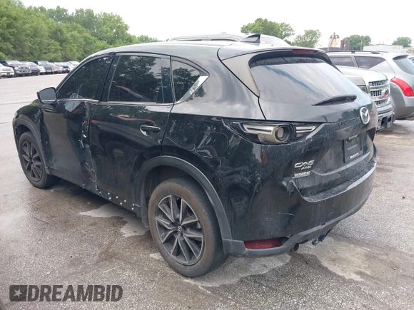 2018 Mazda CX-5 Grand Touring with VIN JM3KFBDM2J0400828, listed as a IAAI auction lot 42540846 with 254,672 mi miles and . Bid and sale history available at DreamBid. Image 3.