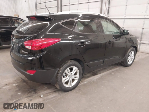 2013 Hyundai Tucson GLS with VIN KM8JU3AC8DU557445, listed as a IAAI auction lot 41839782 with 153,769 mi miles. Bid and sale history available at carsss.com. Image 4.