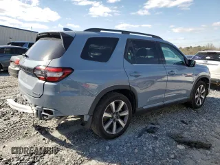 2024 Honda Pilot Touring with VIN 5FNYG2H79RB004803, listed as a Copart auction lot 49702415 with 27,406 mi miles and Salvage title. Bid and sale history available at DreamBid. Image 3.