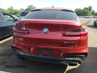 2021 BMW X4 M40i with VIN 5UX2V5C0XM9E78318, listed as a Copart auction lot 57834645 with 67,277 mi miles and Salvage title. Bid and sale history available at DreamBid. Image 6.