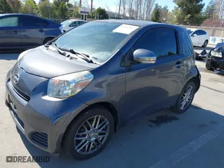2012 Scion iQ with VIN JTNJJXB00CJ009265, listed as a IAAI auction lot 41742947 with 95,857 mi miles. Bid and sale history available at carsss.com. Image 2.