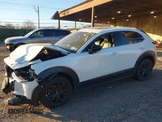 2021 Mazda CX-30 Premium with VIN 3MVDMBDY2MM236118, listed as a IAAI auction lot 41182309 with 32,286 mi miles and . Bid and sale history available at carsss.com. Image 2.
