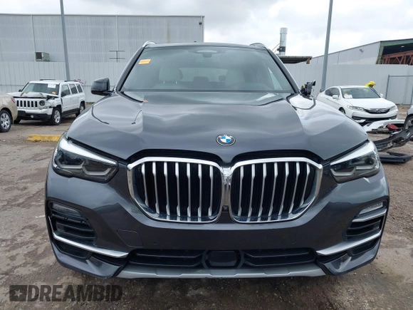 2021 BMW X5 xDrive45e with VIN 5UXTA6C02M9F88978, listed as a IAAI auction lot 42201563 with 23,339 mi miles and . Bid and sale history available at DreamBid. Image 13.
