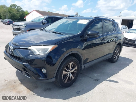 2016 Toyota RAV4 XLE with VIN 2T3WFREV4GW294428, listed as a IAAI auction lot 39168618 with 115,791 mi miles. Bid and sale history available at carsss.com. Image 2.